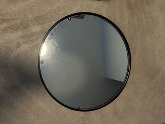 Black frame round wall mirror