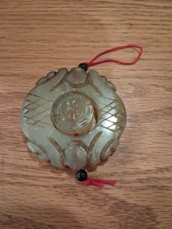 Carved Jade Pendant with Red Cord