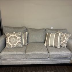 Light blue/grey Couch With 4 pillows