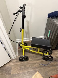 folding knee scooter with storage bag.