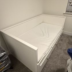 Description Selling an IKEA HEMNES daybed frame in white.