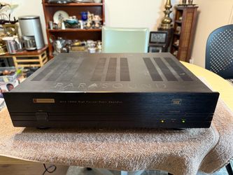 The Parasound HCA 1000A High-Current Power Amplifier in black is a top-of-the-line audio component designed for home audio systems. With stereo L/R RC