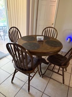 A brown round table with four chairs $100 has to be picked up in Claremont at my sisters she’s moving