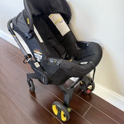 Doona Stroller W/ Brand New Breast Pump Sealed