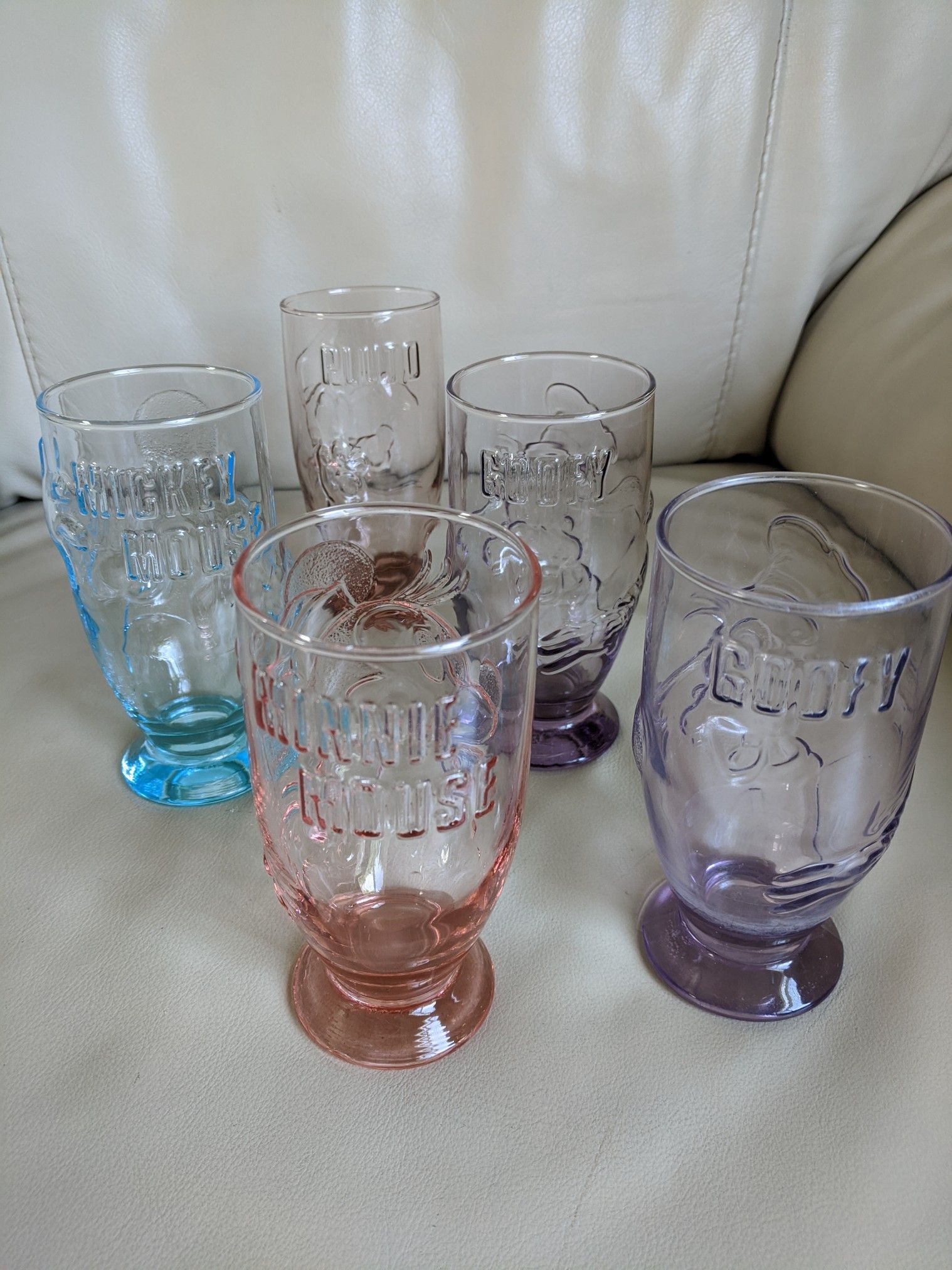 Walt Disney Co. Vintage embossed colorful pedestal drinking glasses with Mickey, Minnie, Goofy, Pluto.