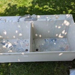 Used Double Sided Utility Slop Sink Standard Size. Needs Legs