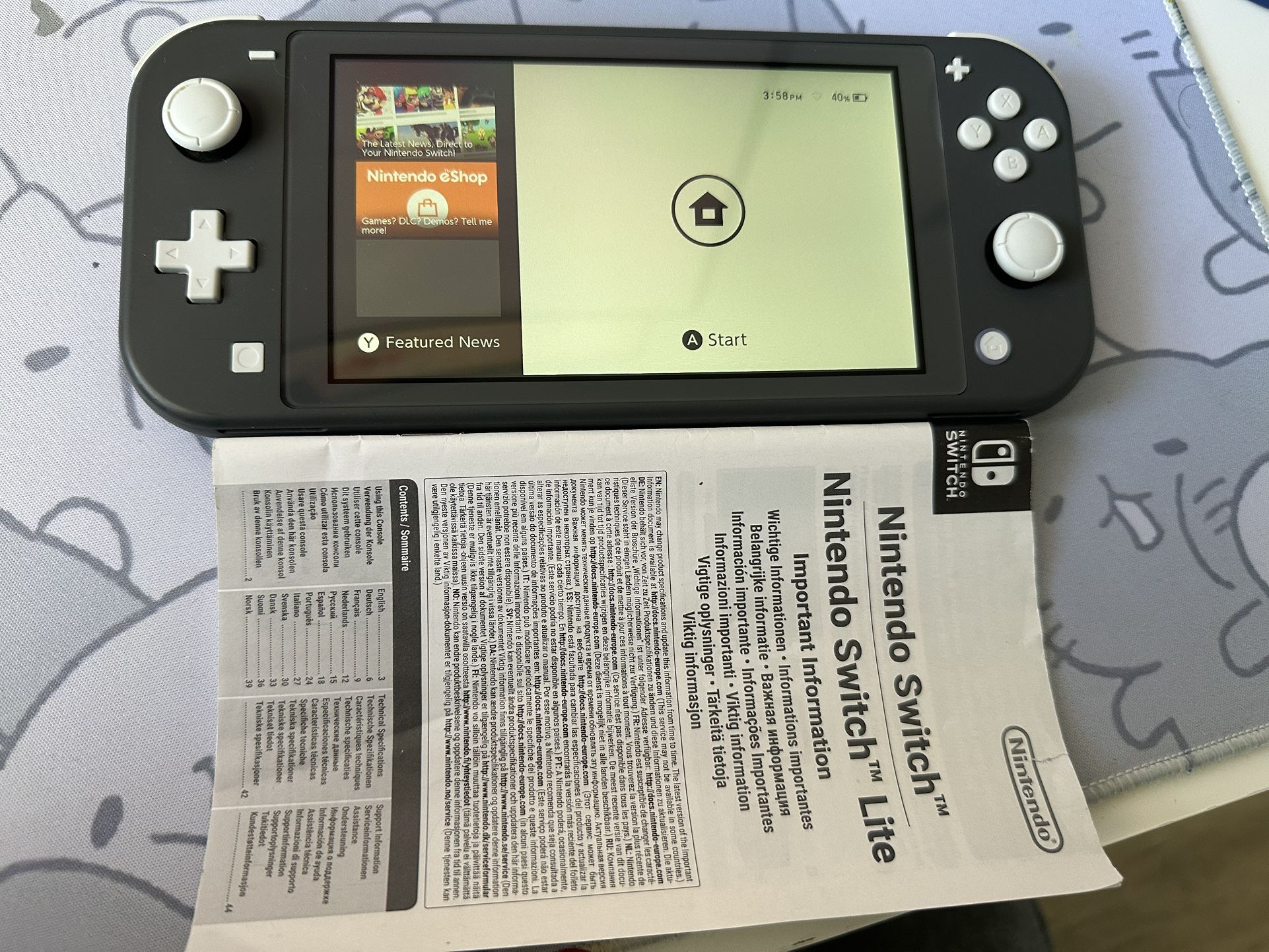 Nintendo Switch Lite Box,game,and Charger
