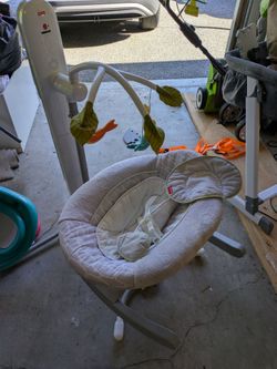 Powered baby rocker with lights and music
