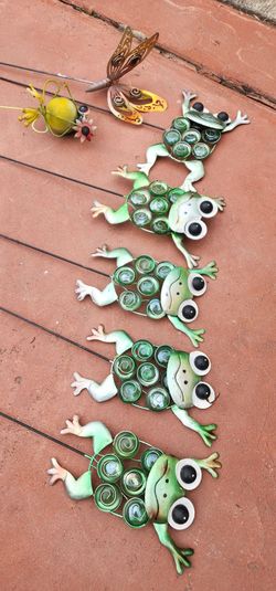 Decorative garden frogs with stones