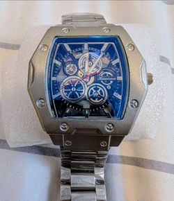 Silver color watch with light blue face. Very elegant watch