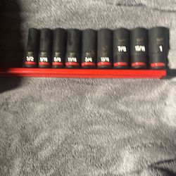 Like new Milwaukee half inch nine peace standard deep socket set