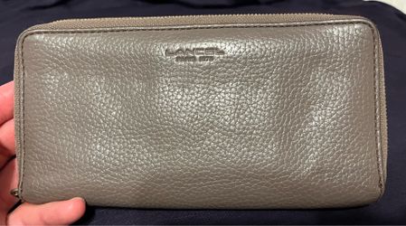 Lancel Paris 1876 wallet features a gray tumbled leather exterior with a zip-around closure(Pick up Only 90042)