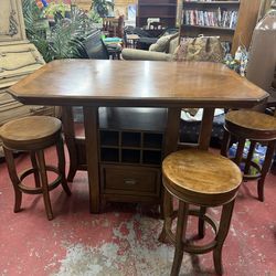 Solid wood pub style table with 4 stools