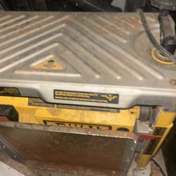 This is a DEWALT 15 Amp Corded 12.5 in. Bench Planer, model DW734. 