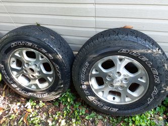 4 Bridgestone 245 70r 16 5 lug dueler all terrain all 4 Rims and tires. Tires are at about 85 % in great condition