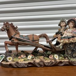 Vintage ceramic and porcelain horse and carriage figurine