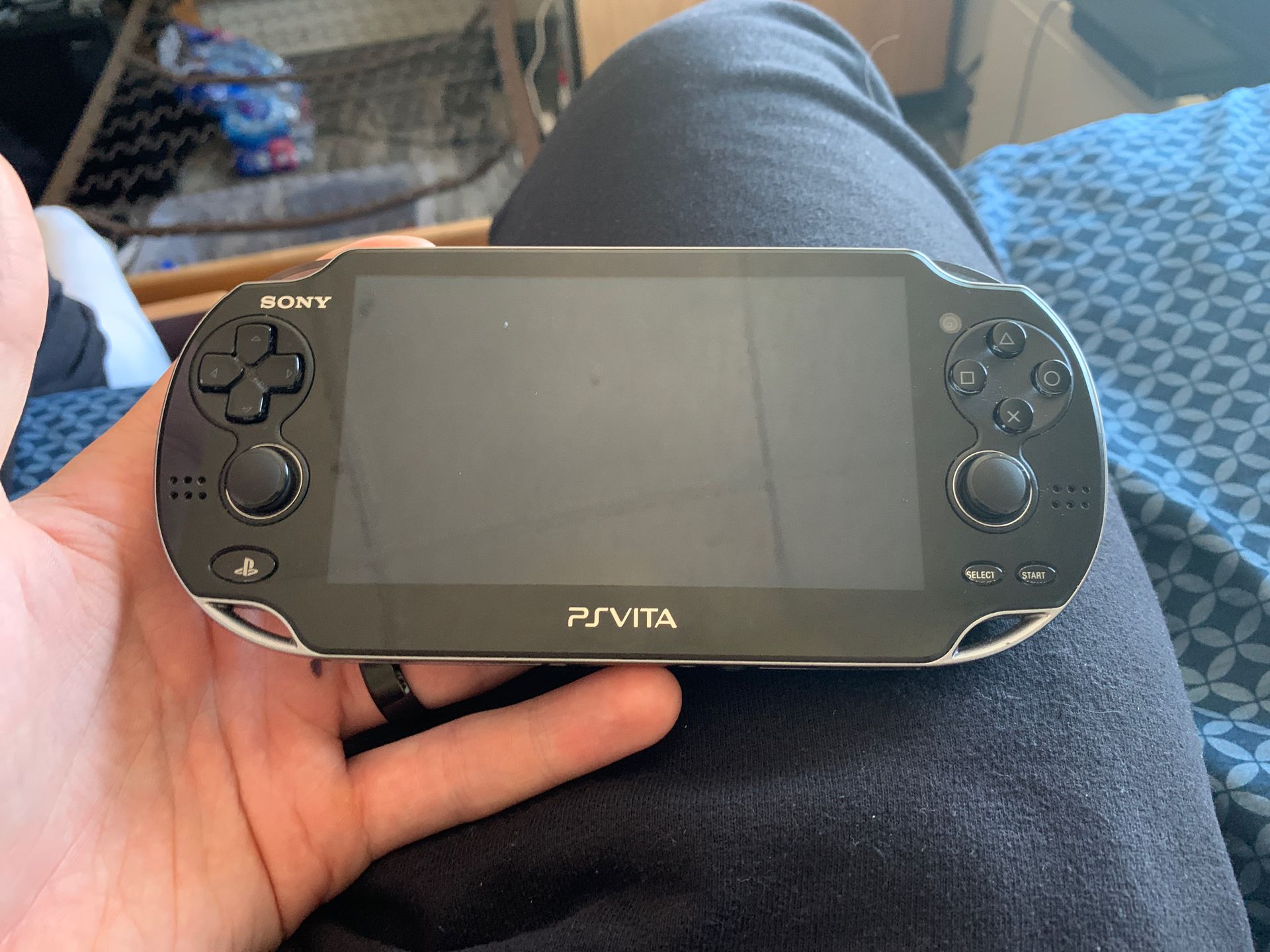 Sony Ps Vita with 2 games 2 SD cards and 2 parts of the charger
