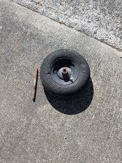 Wheelbarrow tire with axle