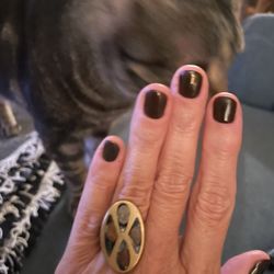 Modernistic oval-shaped face inlaid with fused dichroic glass in brass