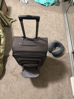 Brown Carry-On Rolling Luggage Suitcase and neck pillows