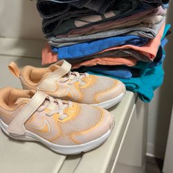 Lots Of Nike Clothes And Pair Of Shoes 