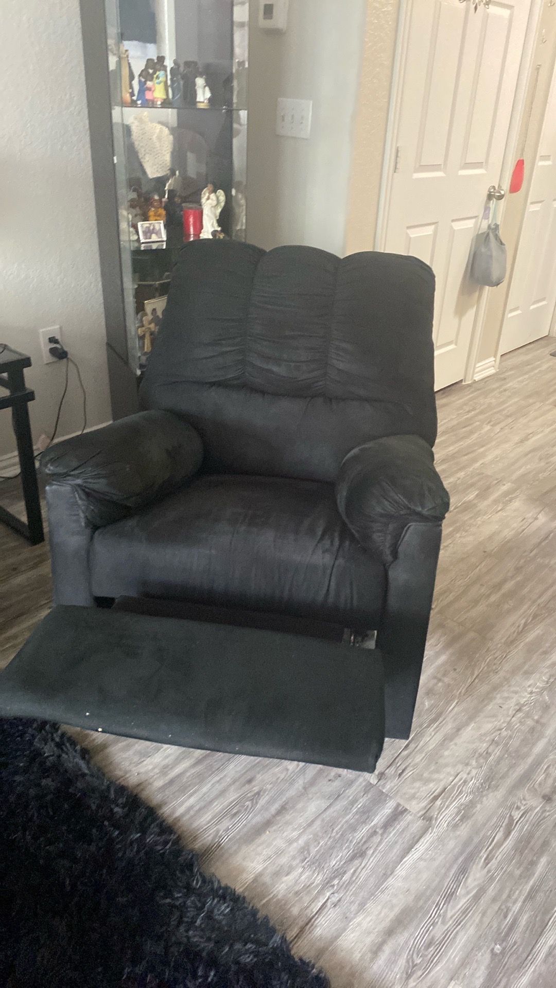 Black velvet recliner very good condition reclines very well black velvet
