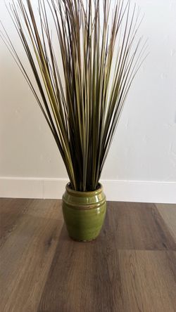 Artificial green grass in green pot decor