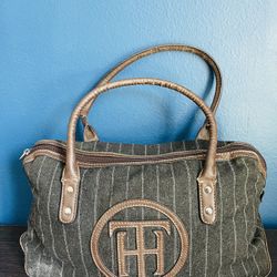 Tommy Hilfiger Purse black wool feel & brown leather handles & bottom zip closure. Elegant, atmospheric, and classic.