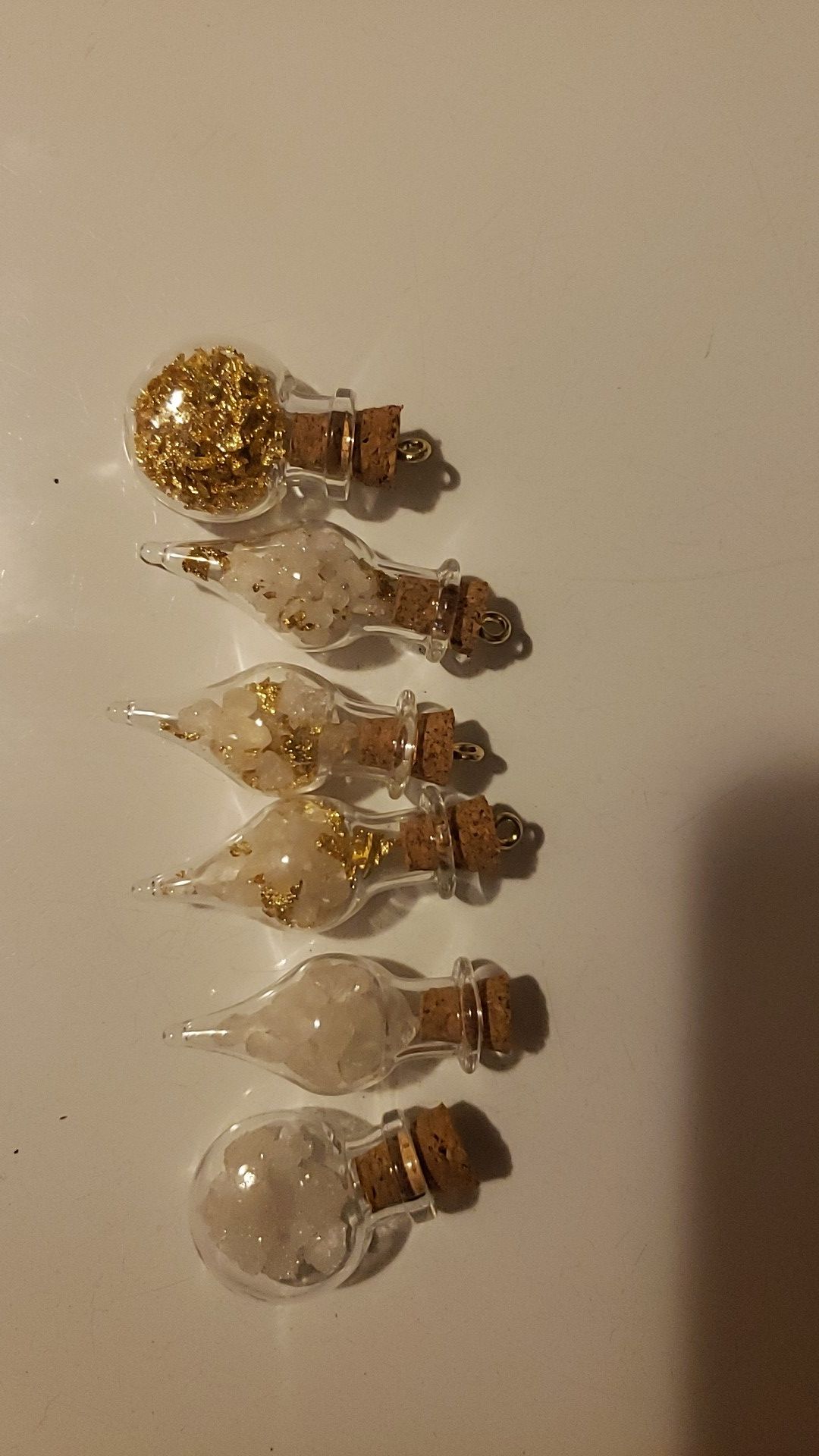 Charms Some have just quartz crystal some have quartz crystals with 24k gold leaf some have just 24k gold leaf Some Silver Beads .