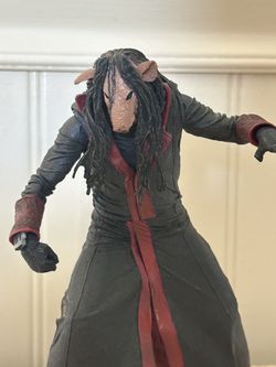 NECA Saw Ultimate Jigsaw Killer action figure, specifically the version in the red robe