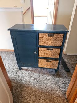 Storage cabinet with 3 baskets