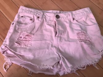 Light pink distressed denim shorts