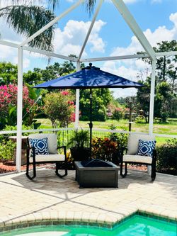 Like new 2 Rockers for outdoor patio with 9’ Umbrella . Optional Firepit