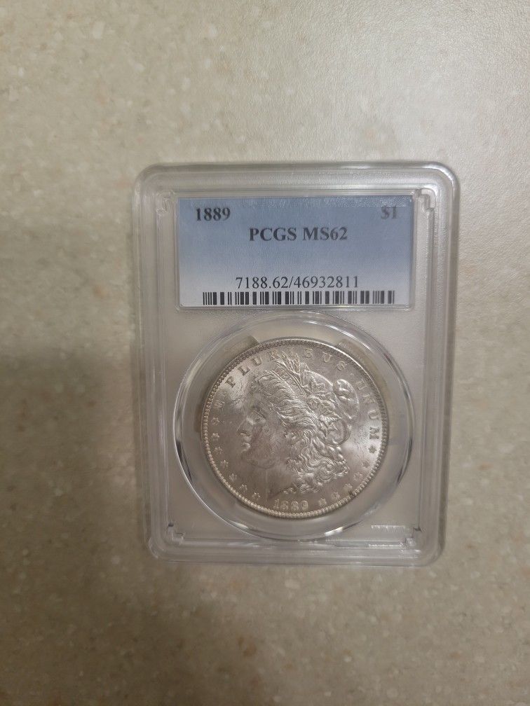 1889 Morgan Silver Dollar. Graded