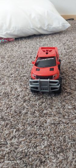 Toy red monster pick up truck