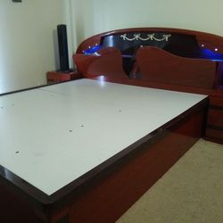 King size wooden bed frame well polished with two side cabinets(negotiable)