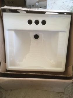 New - open box American Standard wall hung sink. Model Decorum in Cotton white