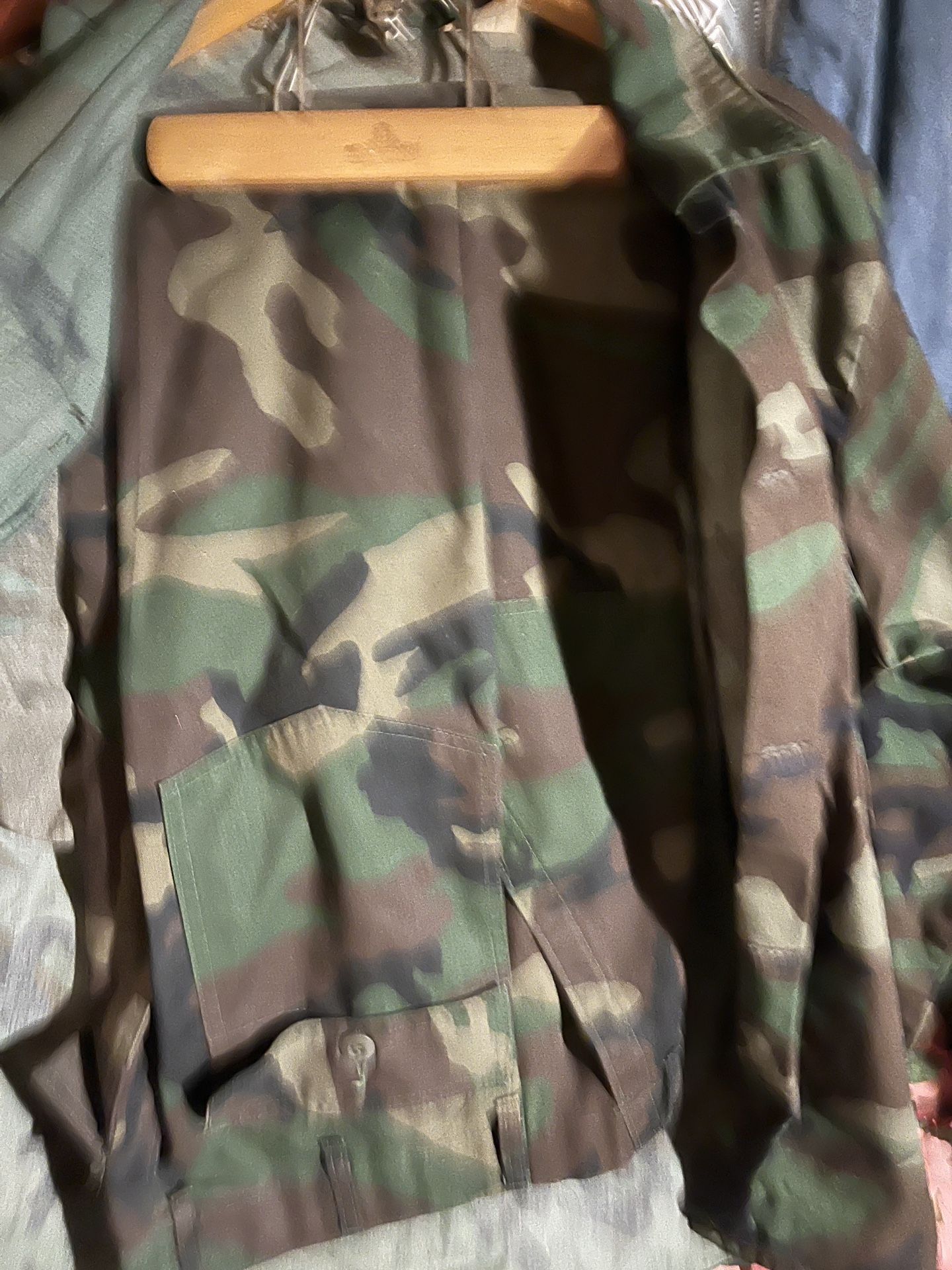 Camouflage fatigues 1 Winter Coat 1 Utility Shirt 2 Pants One Gray One Green