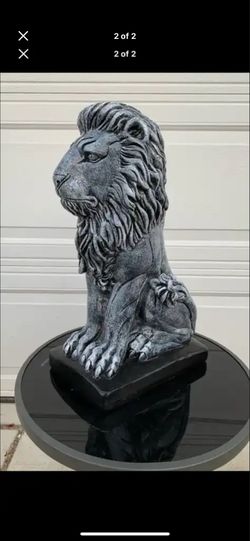 Stone colored lion statue