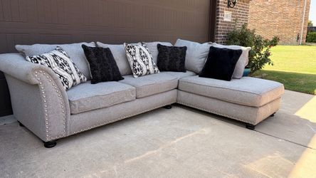 REDUCED PRICE!  Beautiful Gray Sectional. Used in great condition. All pillows included!