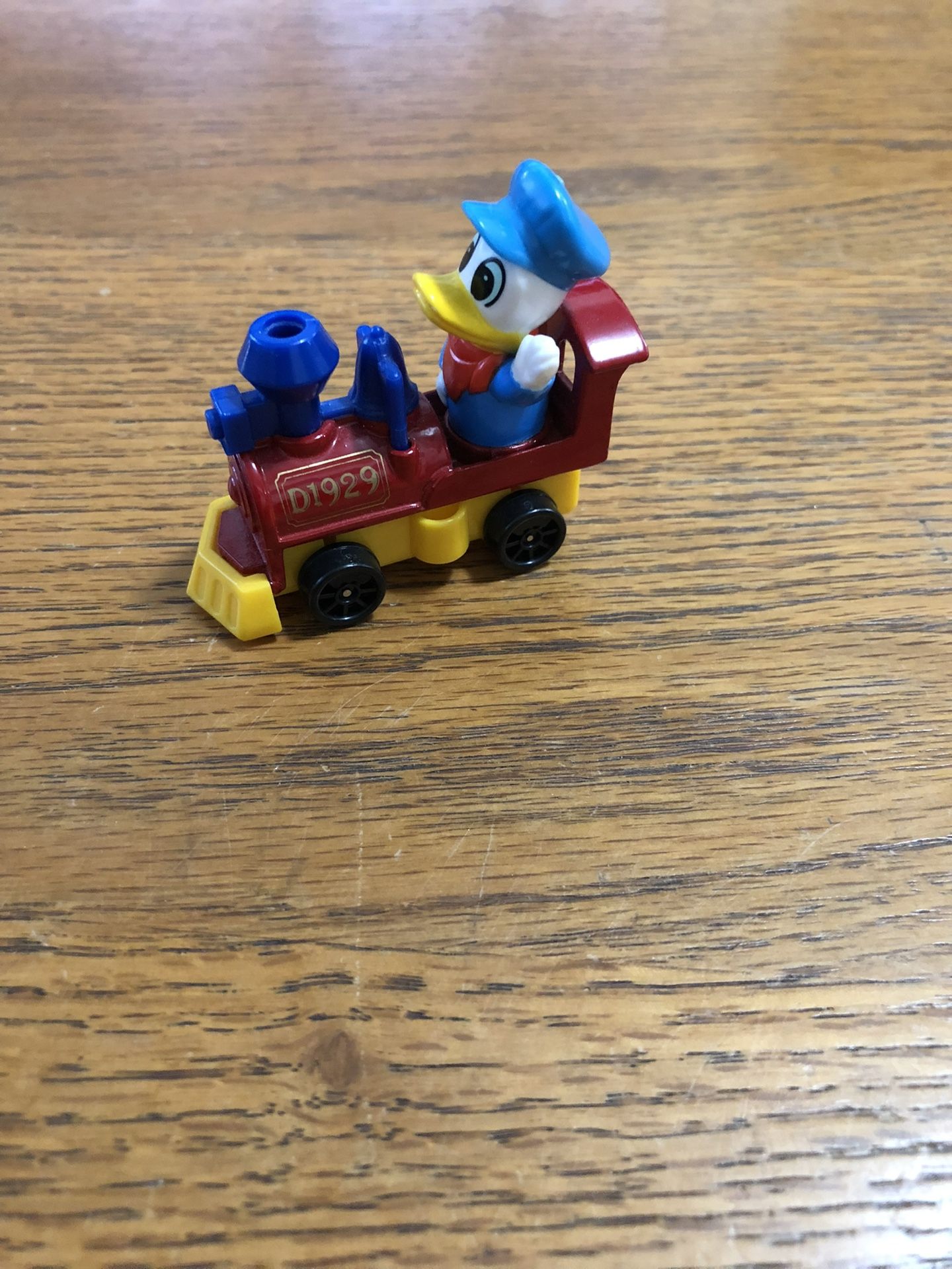 Vintage Walt Disney Productions Toy Train Locomotive With Donald Duck . Size 2 1/4 inches Long and 1 inches wide. Brand New Never Used.