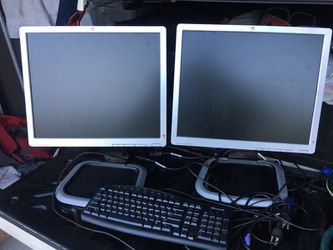 Dual HP computer monitors w/ keyboard