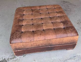Real leather ottoman/footstool. Modern