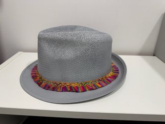 Gray woven hat with colorful fringe