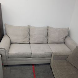 Small three seater beige couch
