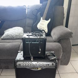 Guitar, Guitar Bag, And Two Amps