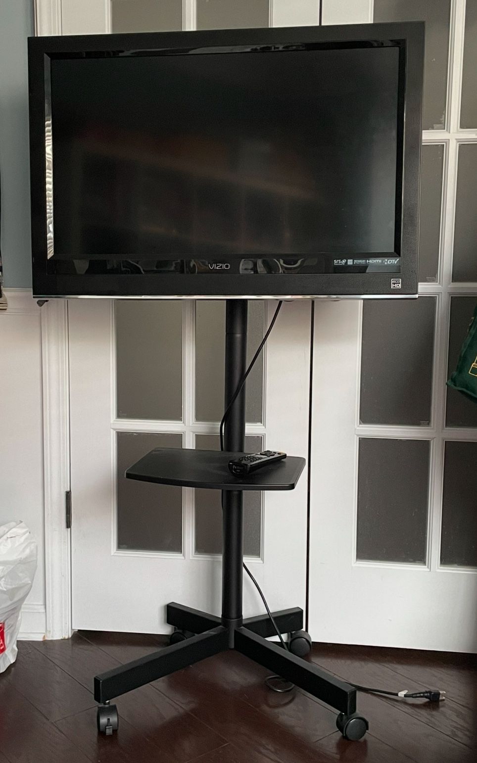 31 1/3” TV VIZIO Model VO320E With TV Rolling Stand MT 2004 And Shelf