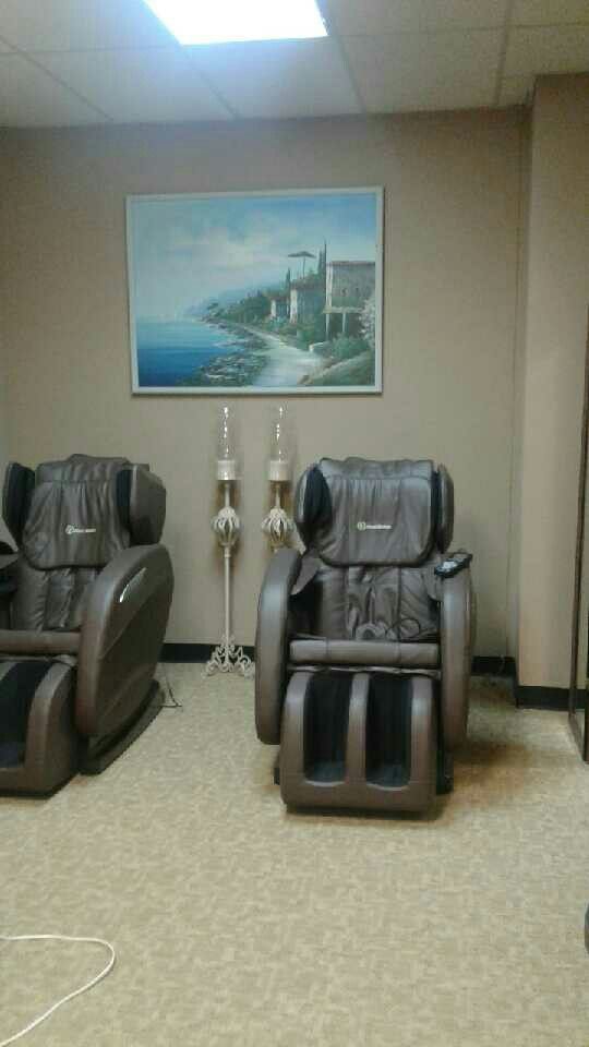 His and her full body massage chairs