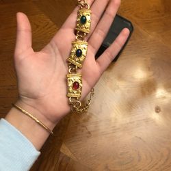 Golden necklace with colorful gemstones