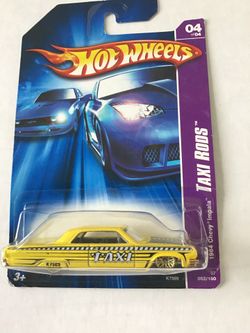 Hot wheels 2006 Series 64 Chevy impala taxi with gold rims.